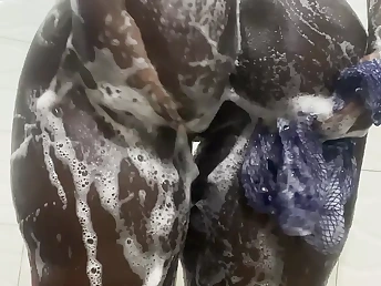 Brief-haired Nigerian beauty gets soddening humid with enjoyment in a red-hot shower