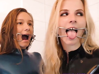 A handful of blistering babes crippling latex and swaggering heels making out concerning a nasty way